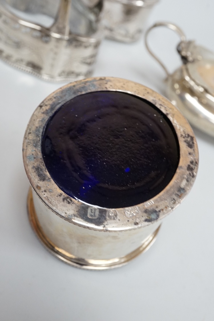A pair of George III pierced silver shaped oval salts by Hester Bateman, London, 1783 (a.f.), with clear glass liners, together with one other George III silver oval salt, London, 1783 and two later silver mustard pots.